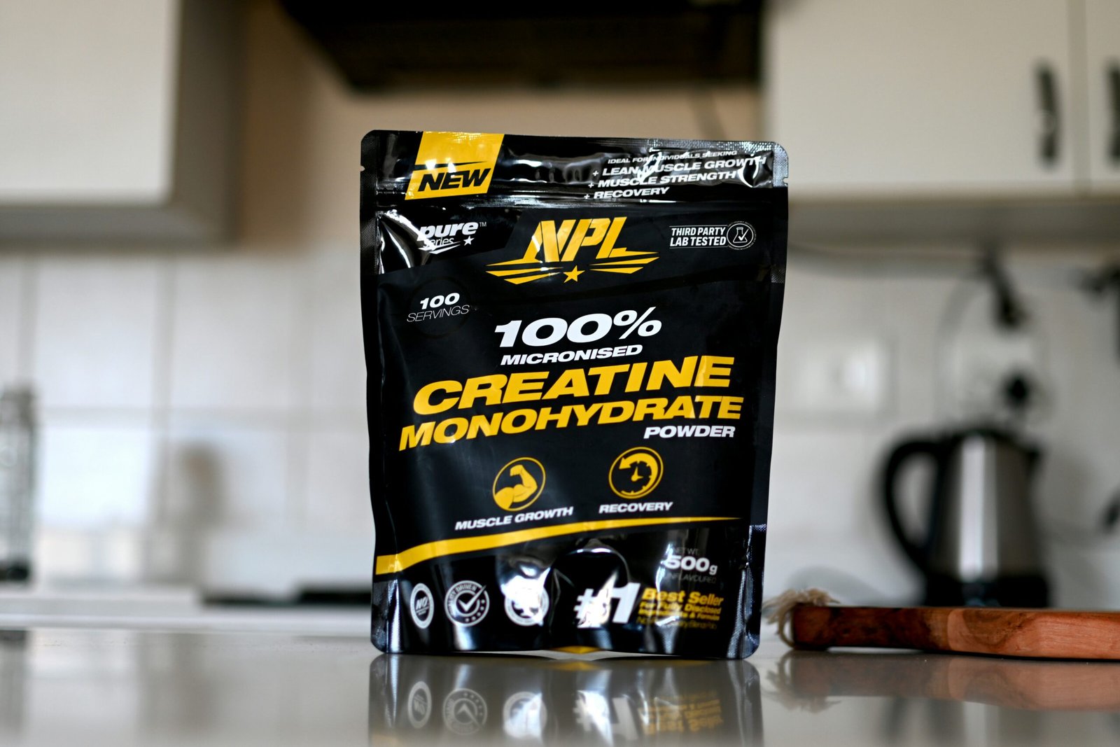 A bag of creatine monohydrate sitting on a counter